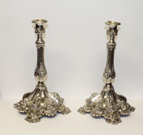 A Pair of Repousse Rococo Silver Candle Sticks