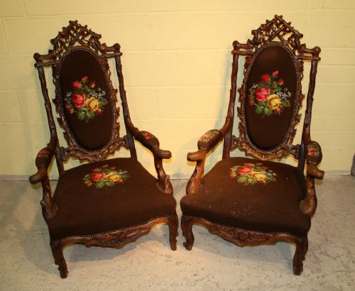 A Pair of Carved Black Forest Armchairs