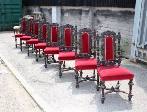 A Set of 8 Carved Oak Jacobean Style Dining Chairs