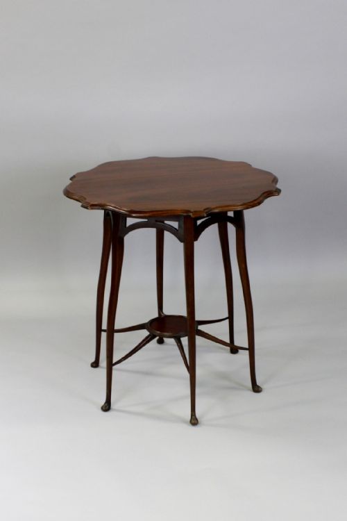 A Mahogany Occasional Table in the Manner of George Jack