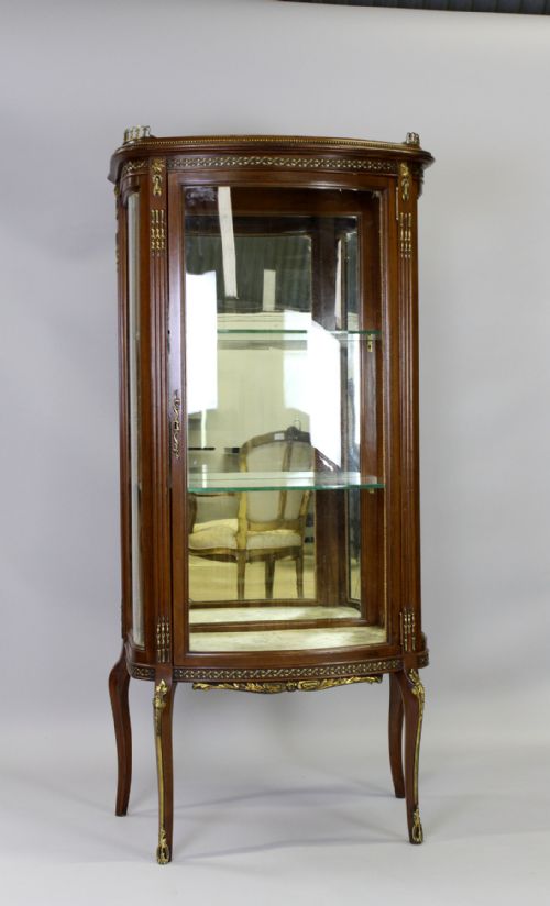 A Mahogany Bow Front Cabinet with Serpentine Sides