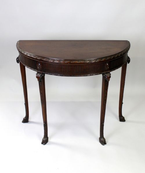 A Carved Mahogany Demi Lune Card Table