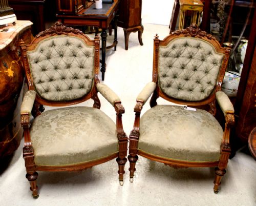 A Fine Quality Pair of Carved Satinwood Arm Chairs