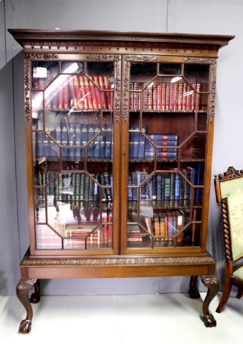 A Carved Mahogany Chippendale Style Bookcase / Cabinet on Stand