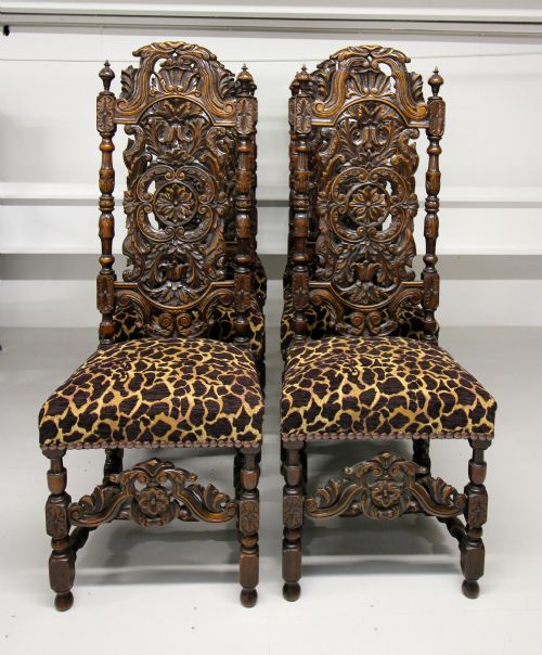 A Set of Six 19th Century Carved Oak Carolean Style Chairs