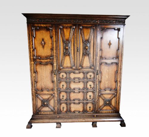 A Jacobean Style Carved Oak Bedroom Suite