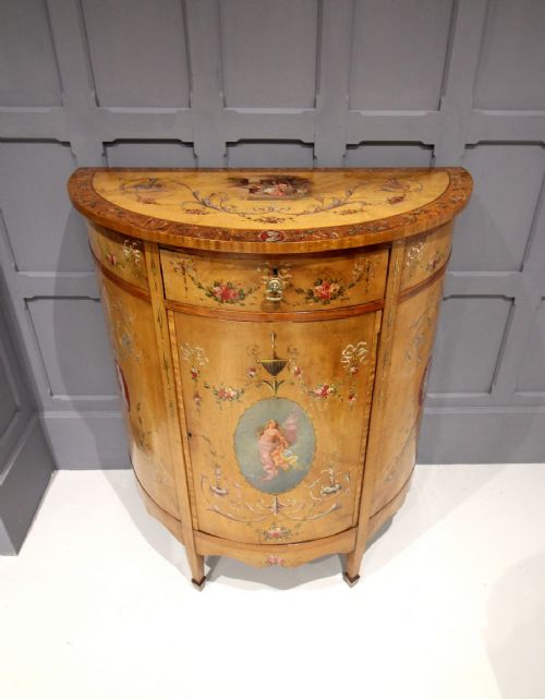A Satinwood Painted Demi Lune Side Cabinet