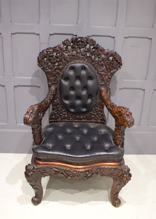 A Japanese Carved Upholstered Armchair