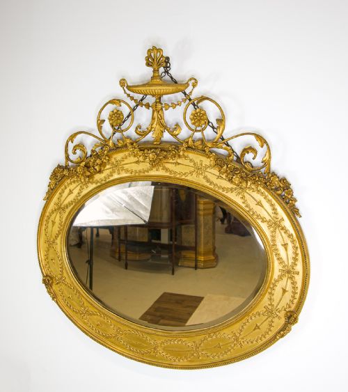 fig 1. Fine Antique Giltwood Oval Mirror with Urn & Floral Crest – 19th Century