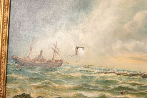 fig 3. A 19th-century marine oil painting by Bernard Benedict Hemy set in a gilded frame, depicting St Marys Island, a steam-sail vessel, and figures working on a rocky shoreline.