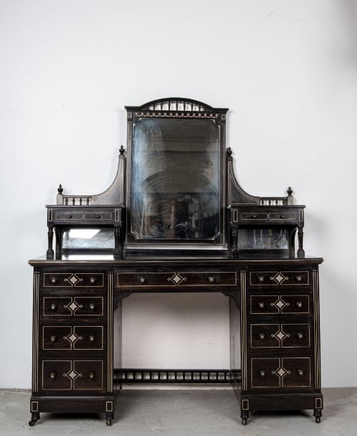 fig 1. A six-piece late Victorian ebonised bedroom suite featuring bone inlay, comprising a half-tester bed, mirror wardrobe, dressing table, marble-top washstand, nightstand, and towel rail.