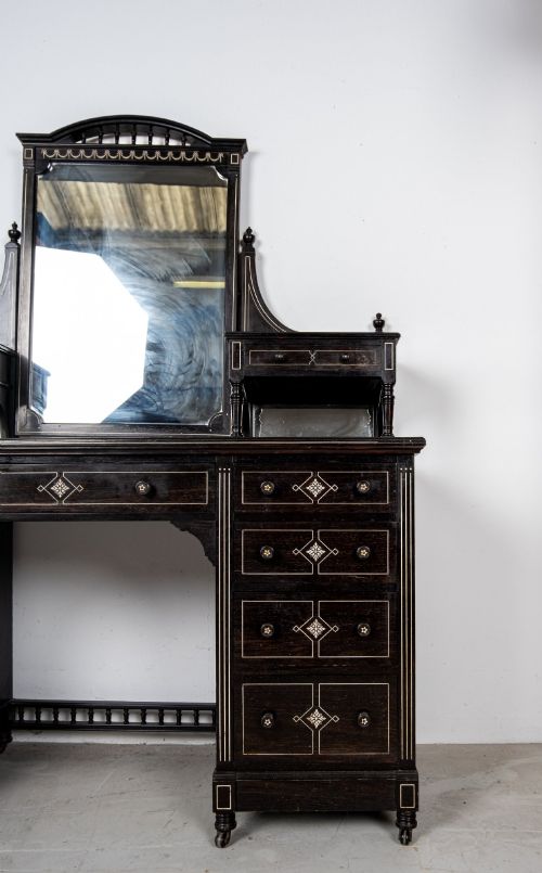 fig 3. A six-piece late Victorian ebonised bedroom suite featuring bone inlay, comprising a half-tester bed, mirror wardrobe, dressing table, marble-top washstand, nightstand, and towel rail.