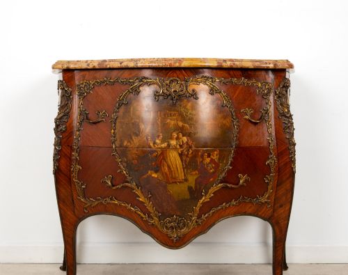 fig 5. A French Louis XV revival bombee commode in kingwood with gilt-bronze mounts, a central hand-painted Vernis Martin scene, and a marble top.