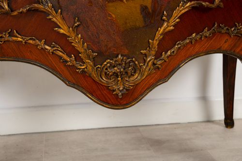 fig 7. A French Louis XV revival bombee commode in kingwood with gilt-bronze mounts, a central hand-painted Vernis Martin scene, and a marble top.