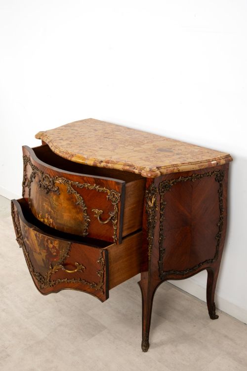 fig 10. A French Louis XV revival bombee commode in kingwood with gilt-bronze mounts, a central hand-painted Vernis Martin scene, and a marble top.