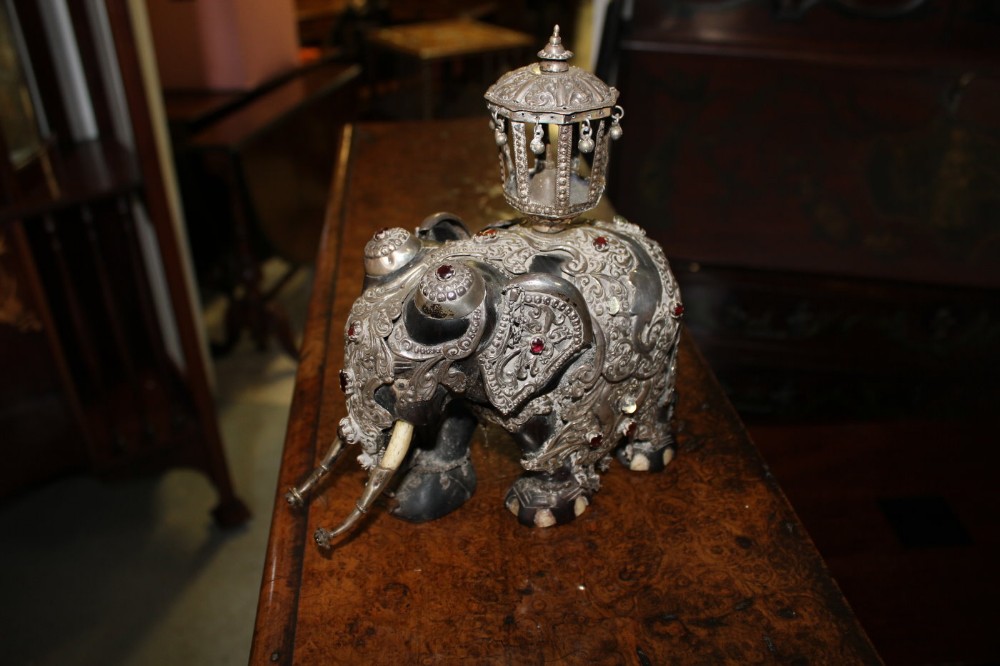 An Ebonised Elephant Adorned With Silver And Stones