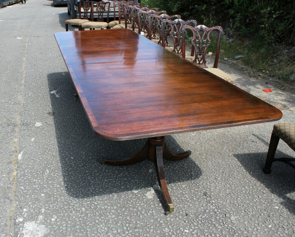 An Early 20th Century 3 leaf Mahogany Twin Pillar Dining Table