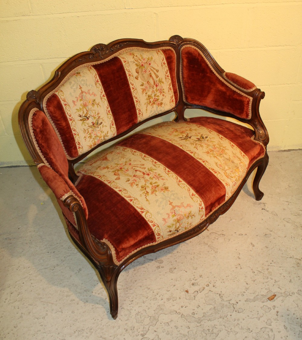 A French Carved Walnut Canopy Settee 