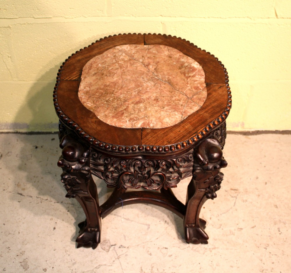 A CHINESE CARVED HARDWOOD STAND