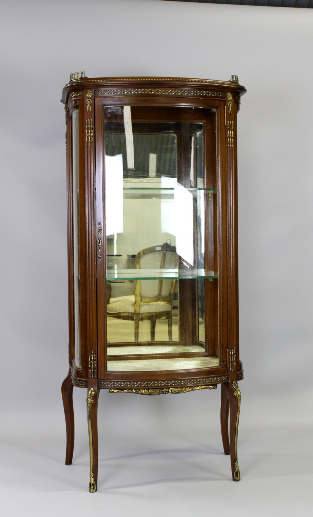 A Mahogany Bow Front Cabinet With Serpentine Sides
