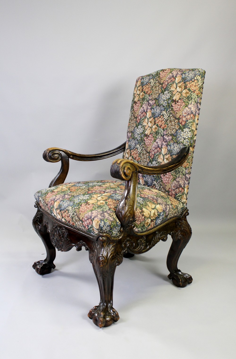A GEORGIAN STYLE CARVED MAHOGANY ARM CHAIR