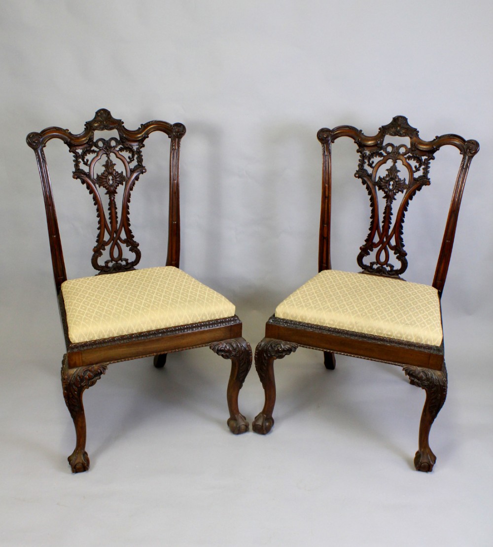 A PAIR OF MAHOGANY CARVED CHIPPENDALE REVIVAL CHAIRS 