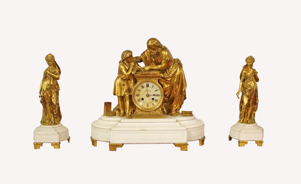 A LOVELY GILT BRONZE 3 PIECE MANTLE CLOCK SET ON WHITE MARBLE BASE 