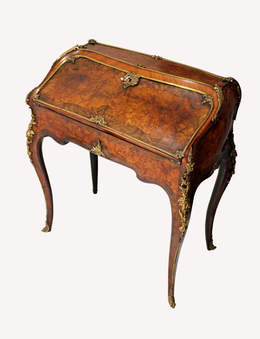 A STUNNING QUALITY ENGLISH BURR WALNUT,KINGWOOD & ORMOLU MOUNTED BUREAU IN SERPENTINE FORM