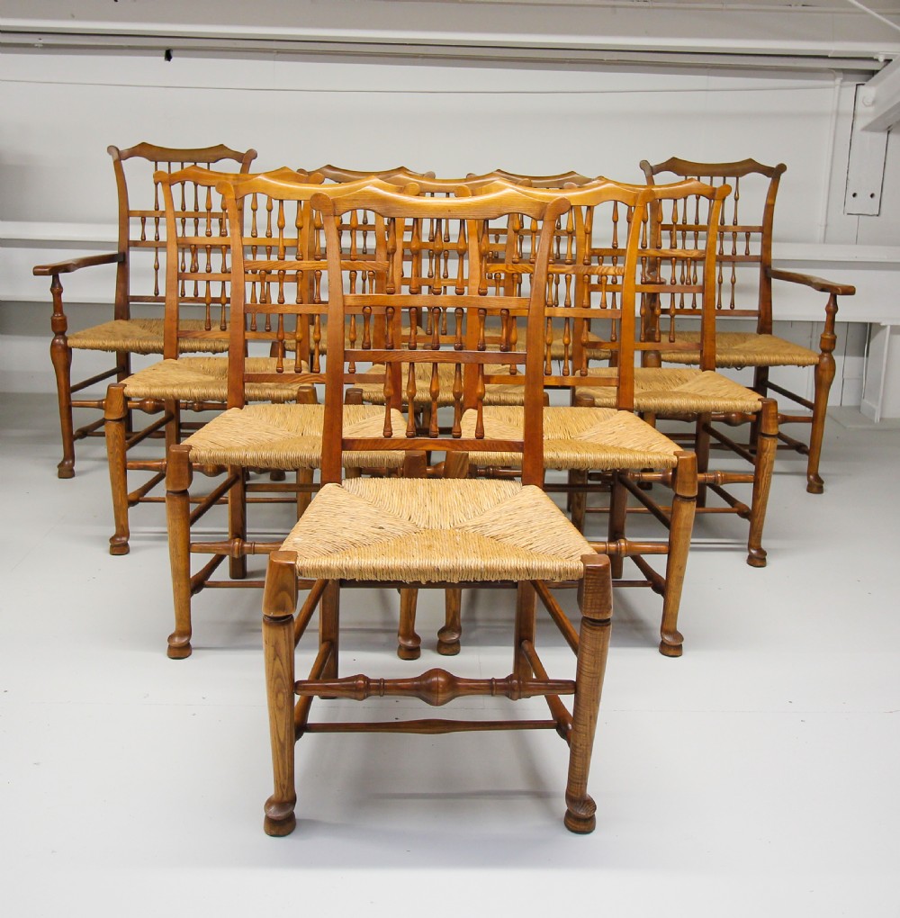 A SET OF TEN ASH RUSH SEAT SPINDLE BACK CHAIRS 