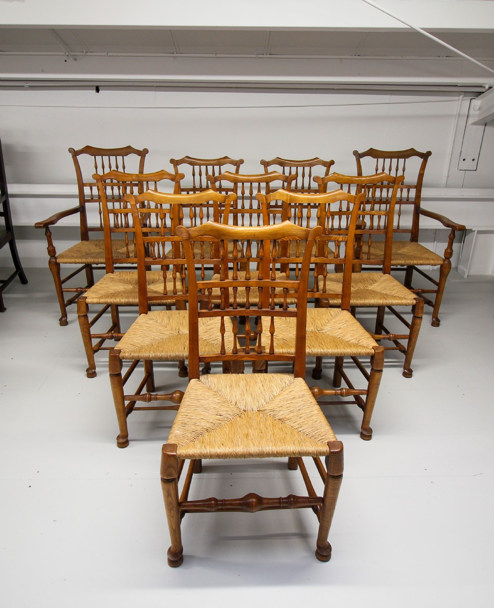 A SET OF TEN ASH RUSH SEAT SPINDLE BACK CHAIRS  View II