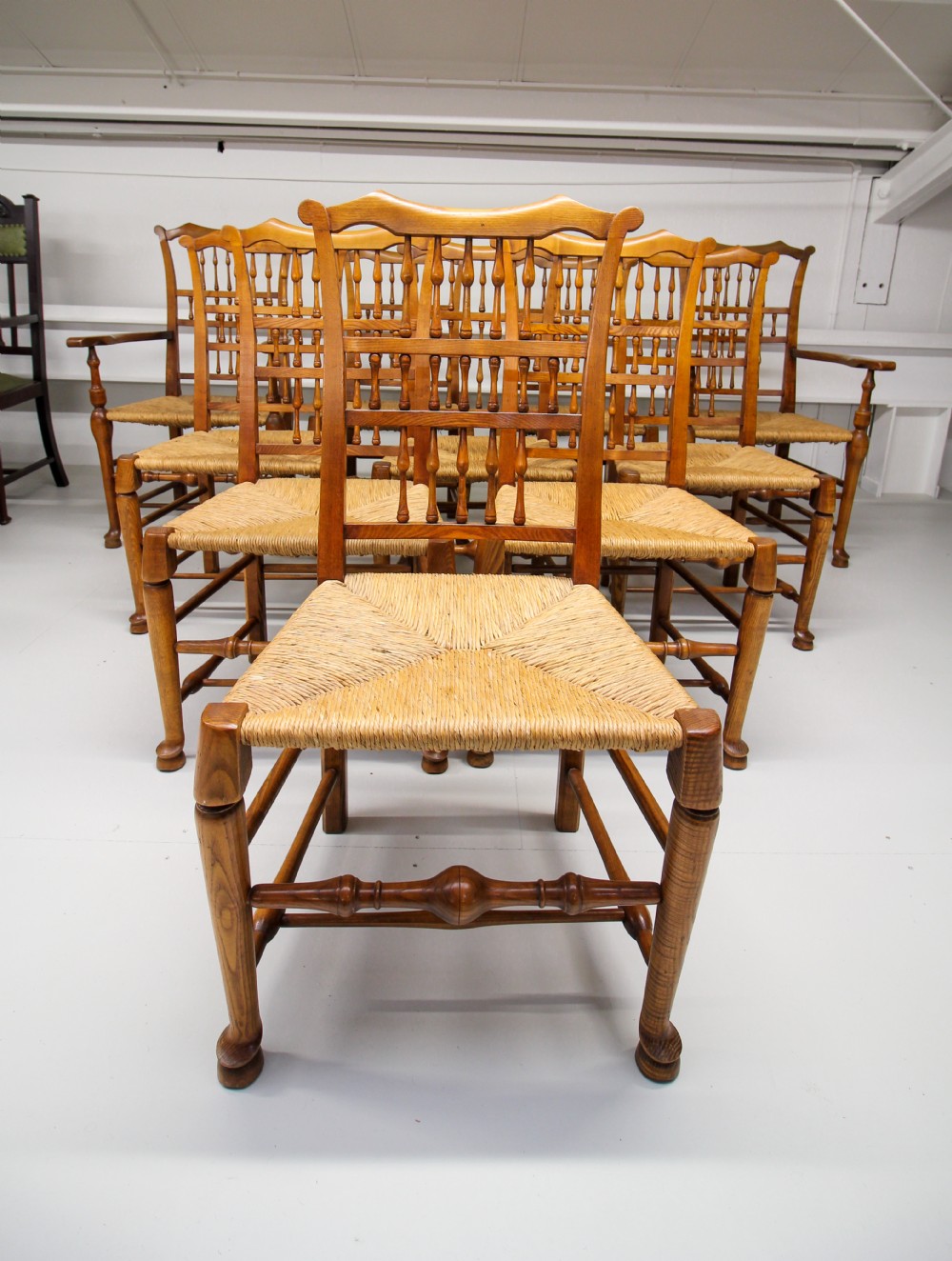 A SET OF TEN ASH RUSH SEAT SPINDLE BACK CHAIRS  View III