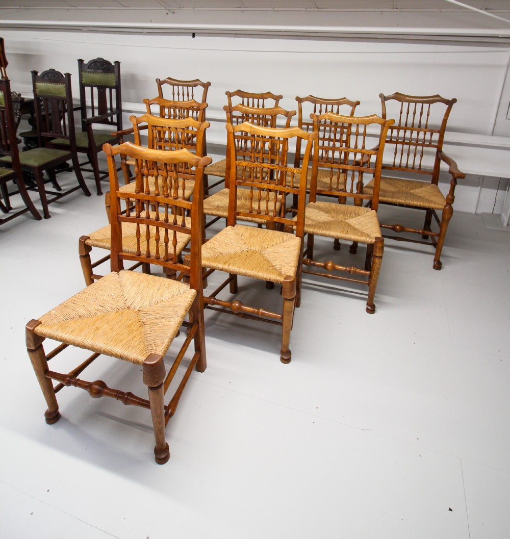A SET OF TEN ASH RUSH SEAT SPINDLE BACK CHAIRS  View IV
