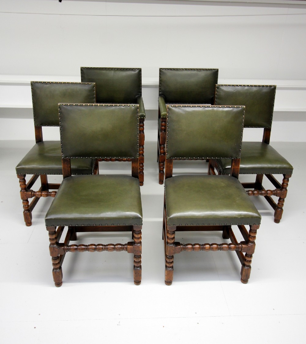 A SET OF 6 OAK LEATHER CHAIRS