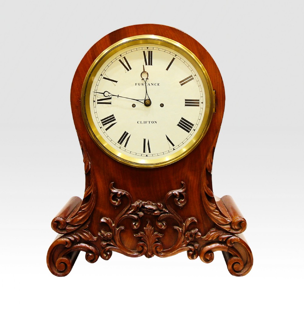 A CARVED MAHOGANY TWIN FUSEE MANTLE CLOCK 