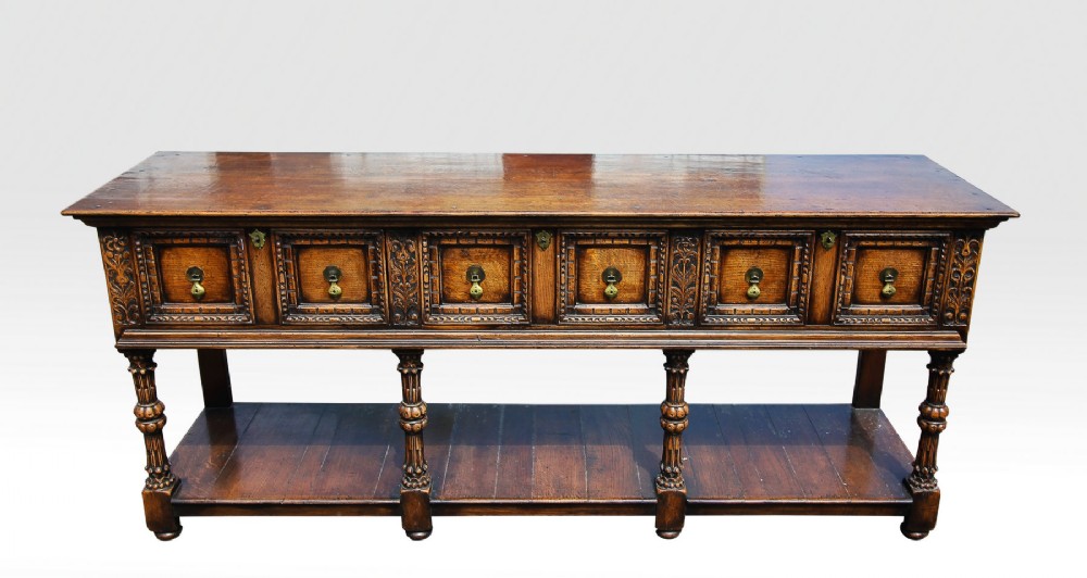 AN OAK DRESSER BASE BY G T RACKSTRAW