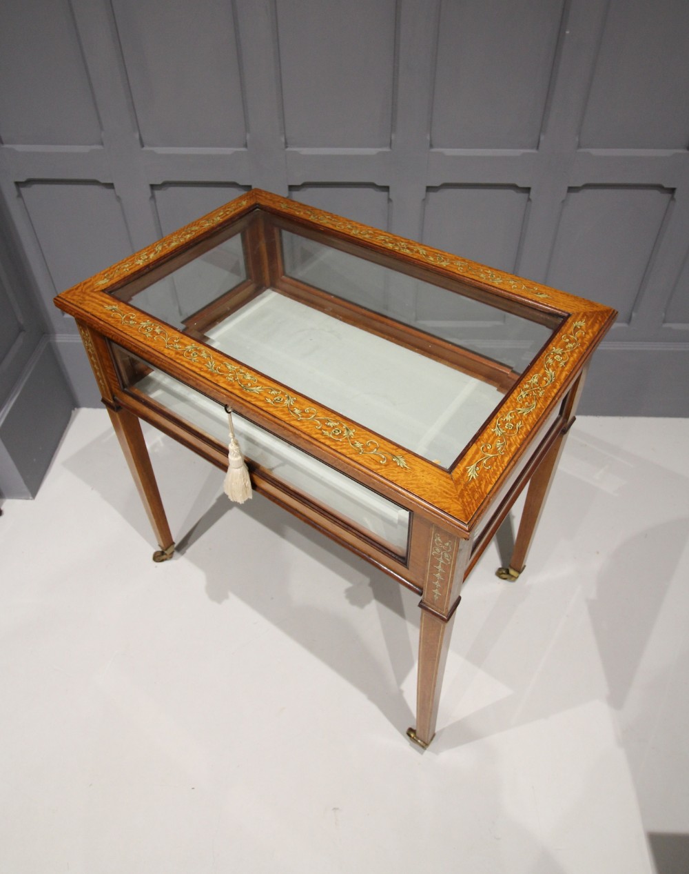 A SATINWOOD INLAID BIJOUTERIE TABLE BY SOPWITH & CO