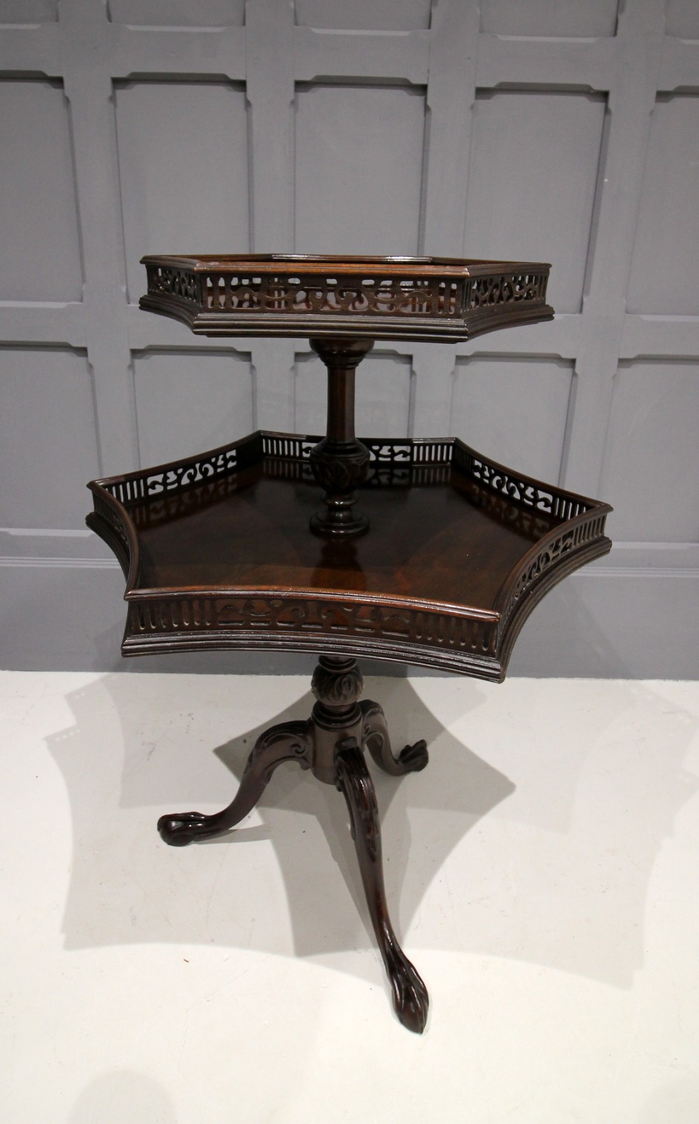 A FLAMED MAHOGANY TWO TIER ETAGERE TABLE
