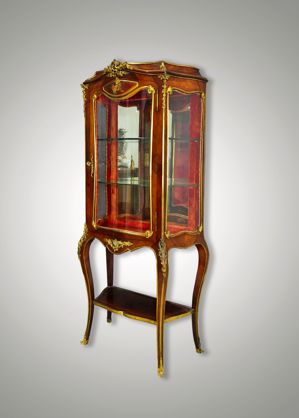 A FRENCH KINGWOOD & ORMOLU MOUNTED VITRINE ON STAND BY MAISON MOTTHEAU