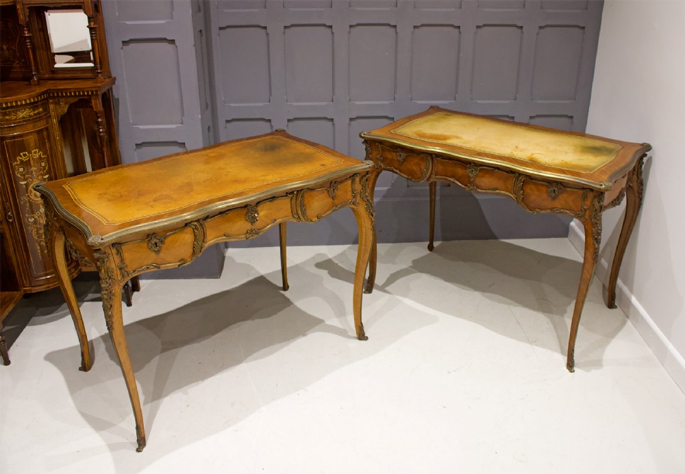 A PAIR OF FRENCH KINGWOOD & ORMOLU MOUNTED WRITING TABLES
