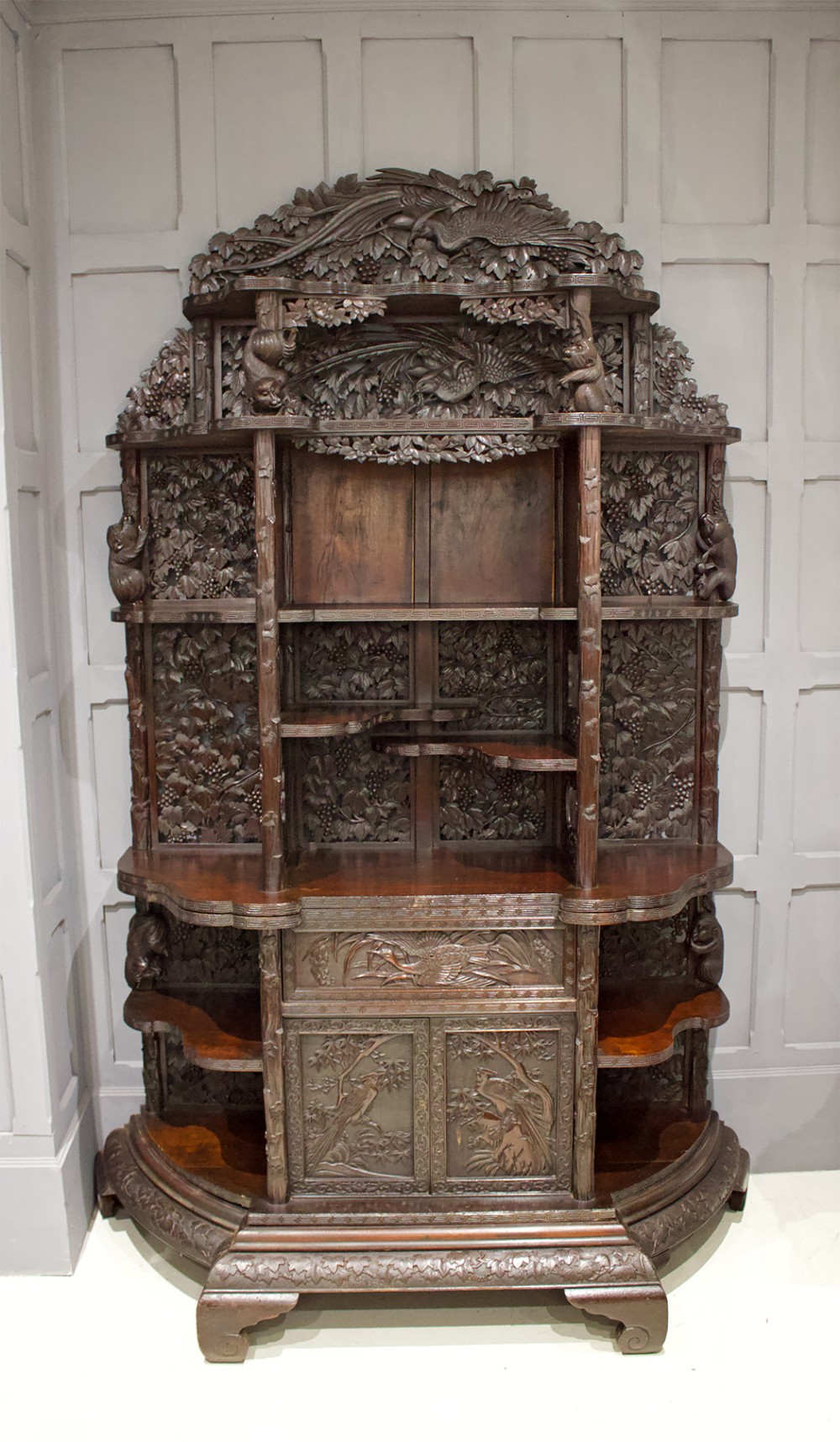 A BEAUTIFUL HAND CARVED CHINESE CABINET WITH MONKEYS