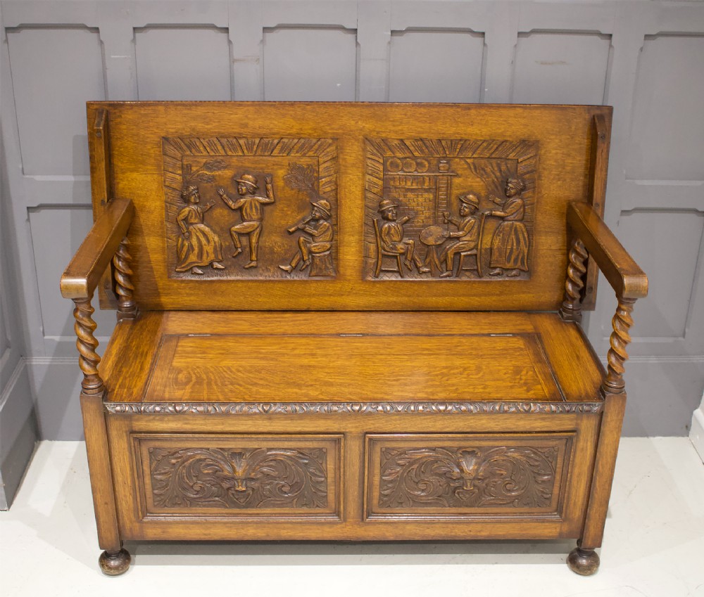 CARVED OAK MONKS BENCH