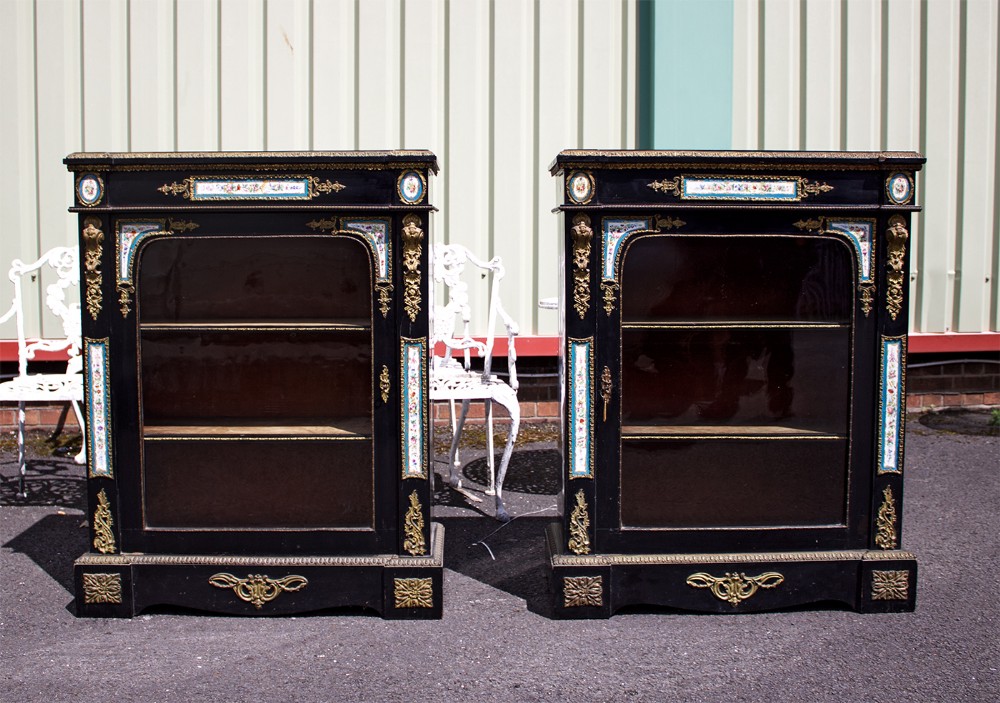PAIR OF 19TH CENTURY EBONISED PIER CABINETS WITH PORCELAIN PLAQUES 