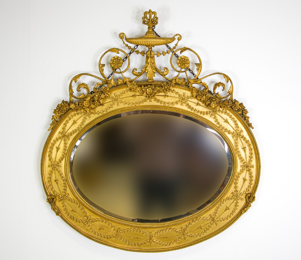Fine Antique Giltwood Oval Mirror with Urn & Floral Crest – 19th Century