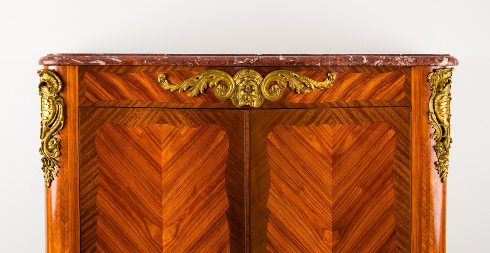 A 19th-century French kingwood side cabinet featuring geometric parquetry doors, gilt bronze mounts, and a marble top. View III