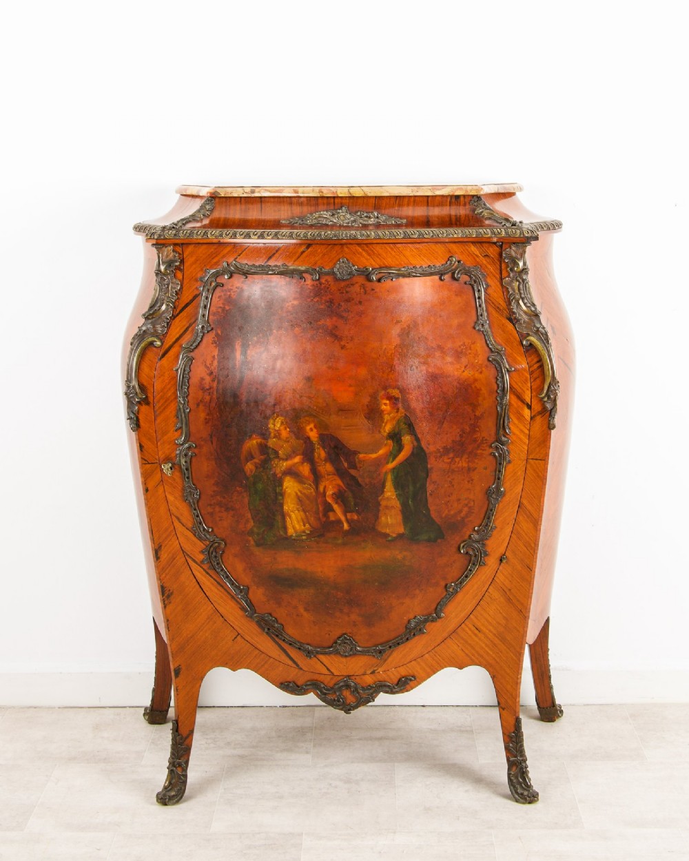 An antique French Louis XV style kingwood side cabinet featuring a shaped marble top, intricate gilt bronze mounts, cabriole legs, and a central Vernis Martin painted panel.