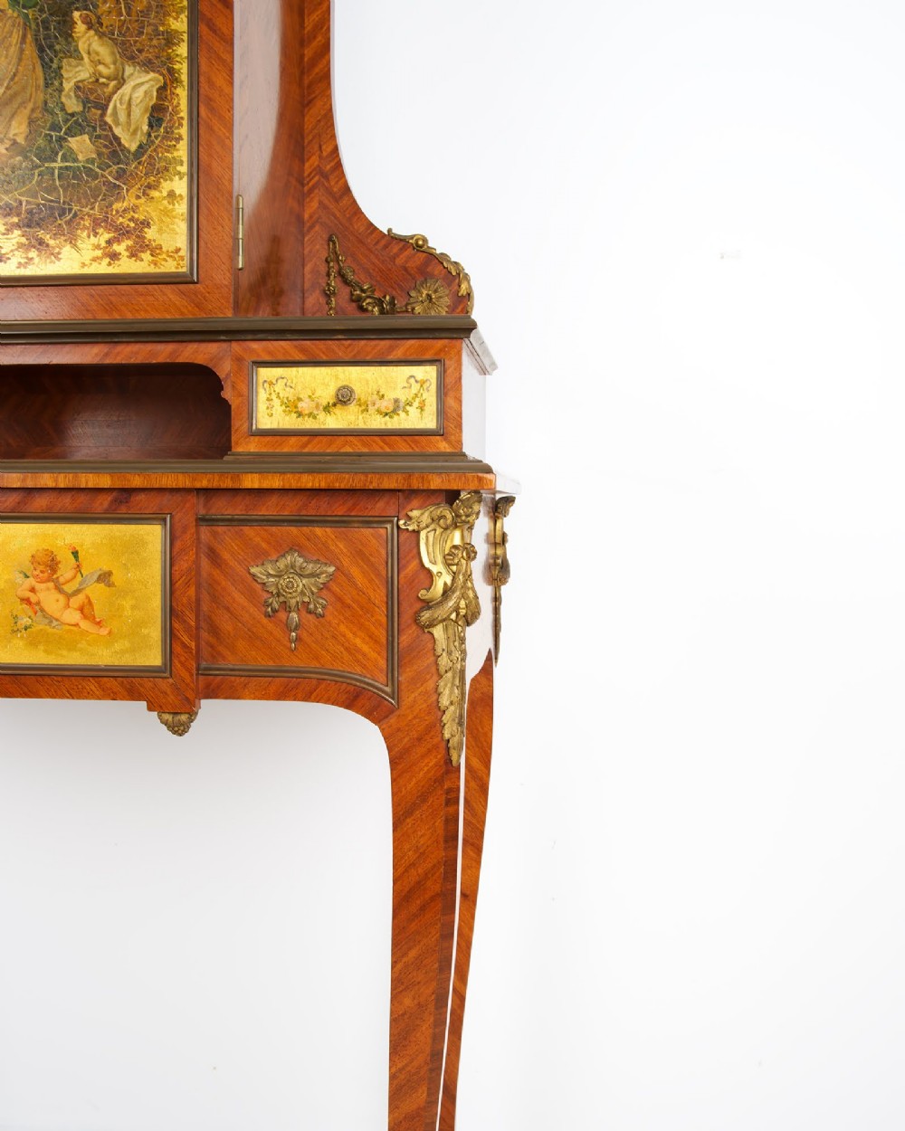 A nineteenth-century French kingwood writing cabinet featuring slender cabriole legs, gilt-bronze mounts, and a central Vernis Martin painted panel depicting a pastoral scene. View IV