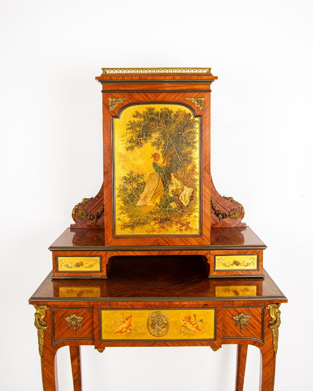 A nineteenth-century French kingwood writing cabinet featuring slender cabriole legs, gilt-bronze mounts, and a central Vernis Martin painted panel depicting a pastoral scene. View V