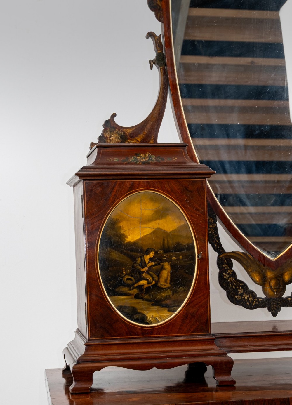 An Edwardian mahogany tabletop toilet mirror with a central shield-shaped swing glass flanked by two small painted cabinet pedestals. View III