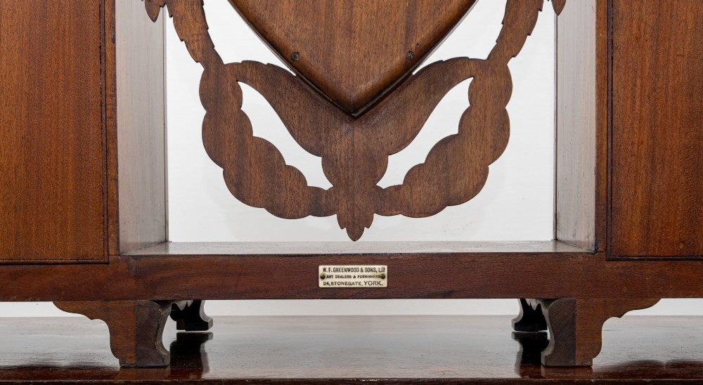 An Edwardian mahogany tabletop toilet mirror with a central shield-shaped swing glass flanked by two small painted cabinet pedestals. View V