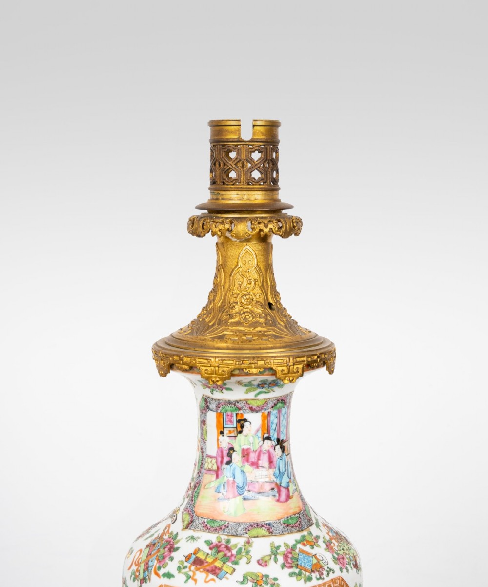 A nineteenth-century Rose Medallion porcelain vase mounted as a table lamp with an ornate gilt bronze base and collar. View V